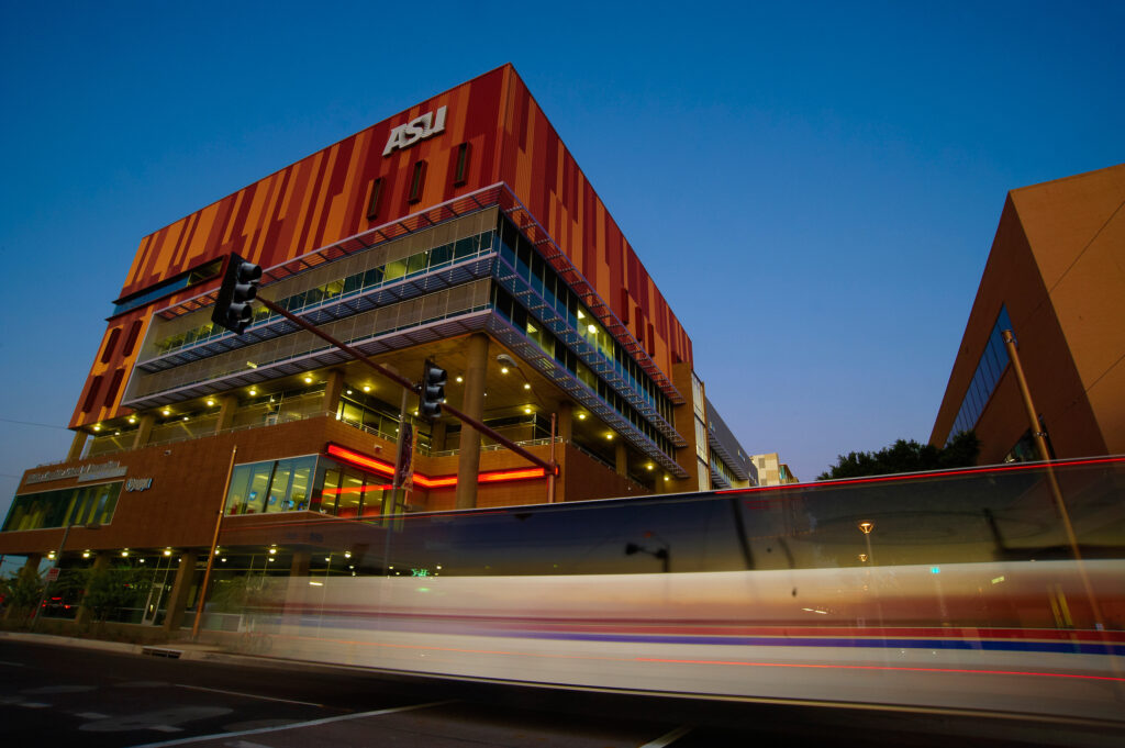 Cronkite, blur, building, lightrail, night